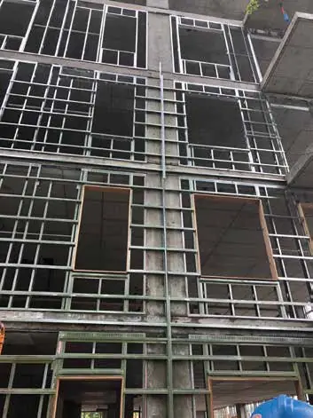 Steel studs with horizontal Z-bars fastened to their outside face