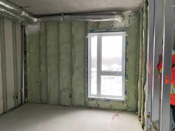 Foamed exterior wall with a window, ready for electrical